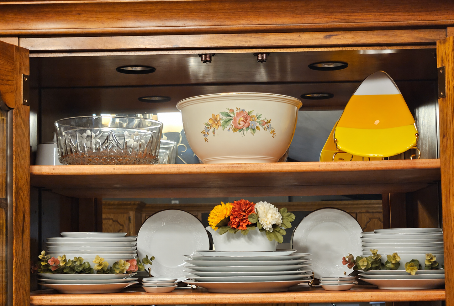Jana’s china hutch arranged with family china and fall decorations